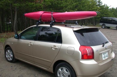 car and river kayak